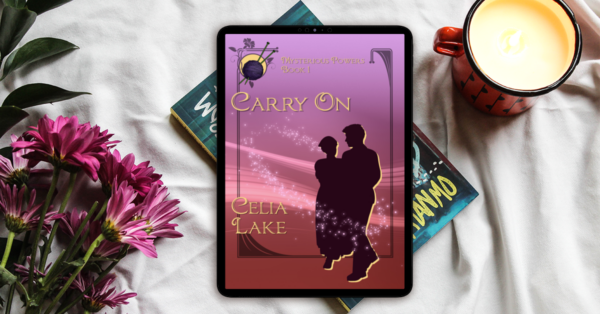 eReader with cover of Carry On showing on it, on a pile of books with some pink flowers.