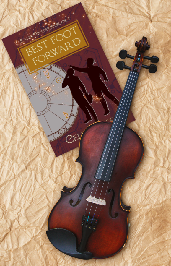 Copy of Best Foot Forward lying on a wrinkled silk cloth, with a violin lying across it. The cover has a deep red background with map markings in a dull purple. Two men in silhouette stand, looking up at a point in the top left. An astrology chart with different symbols picked out takes up the left side of the image, with glowing stars curving up to the title.