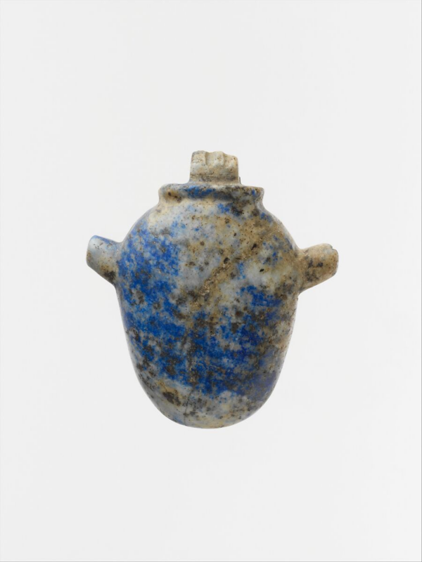 A lapis lazuli heart amulet, with a broad strip of rich blue running from the upper left to the bottom right, a vein of golden ore running through the other direction. It's shaped like a jar, with handles on either side at the top. 
