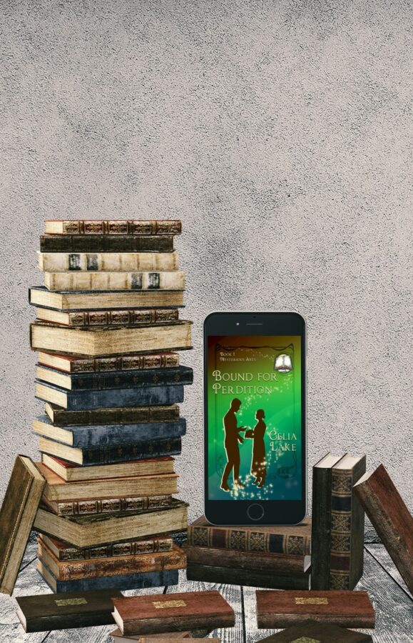 Bound for Perdition displayed on a phone, standing on and surrounded by stacks of leatherbound books. The cover of Bound for Perdition has a man and woman silhouetted in dark brown on a green and brown background, with the woman holding a book while the man gestures. An open blank book and pen are inset in the top right corner.