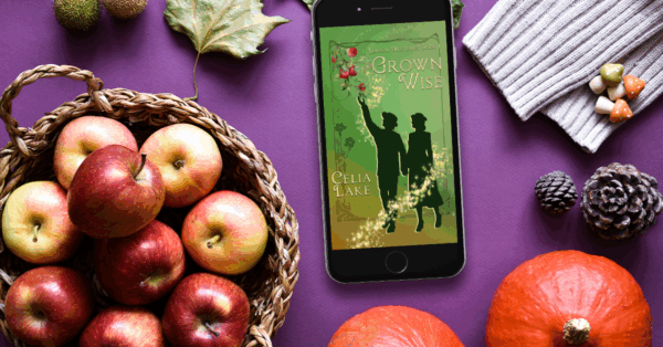 Grown Wise displayed on a phone surrounded by the bounty of the early autumn harvest - apples, squash, and garden items.
