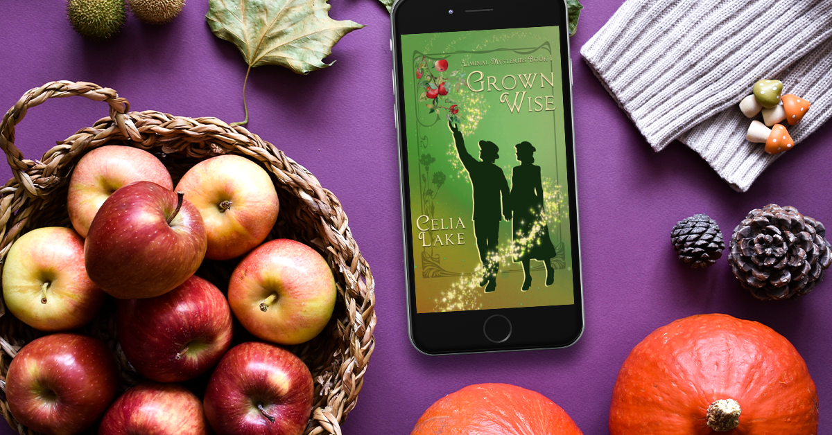 Grown Wise displayed on a phone surrounded by the bounty of the early autumn harvest - apples, squash, and garden items. 